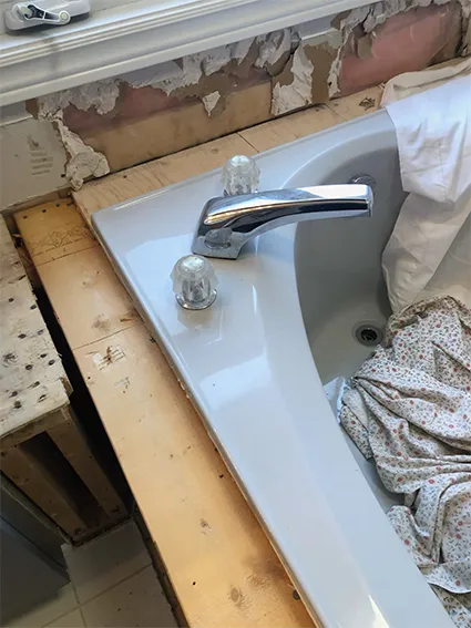 bathtub-new-faucet-installation-on-sunken-tub